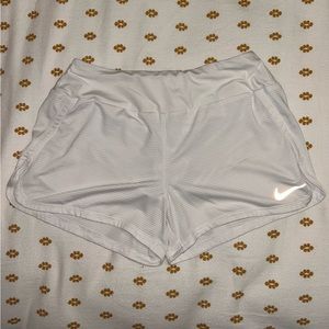 Small, white Nike Dry-Fit shorts